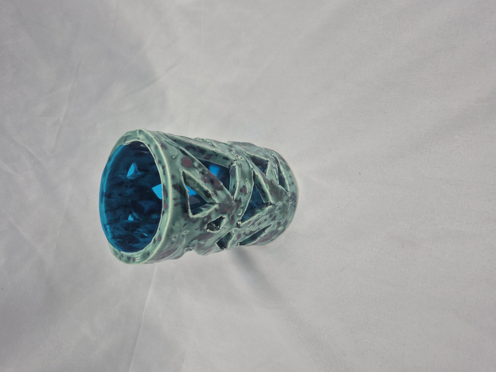 Ceramic pot glazed to resemble polished gemstones